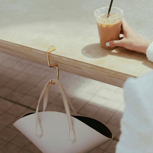 Why Women Are Quietly Stopping Their Handbags From Touching Public Floors - KLIPSTA